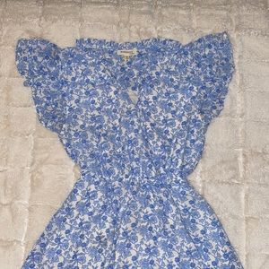Blue and white floral design, ruffled shoulders and neck-hem with a v-neck